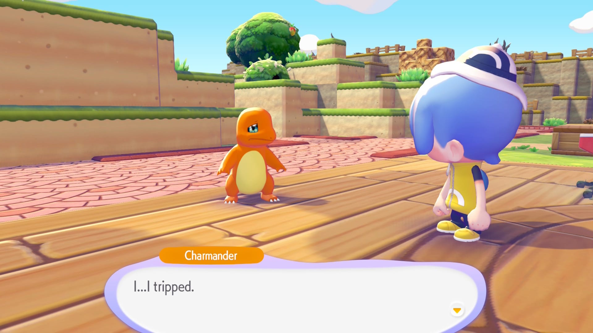 Charmander stands in front of the player character with a speech bubble saying "I...I tripped" and looks sad